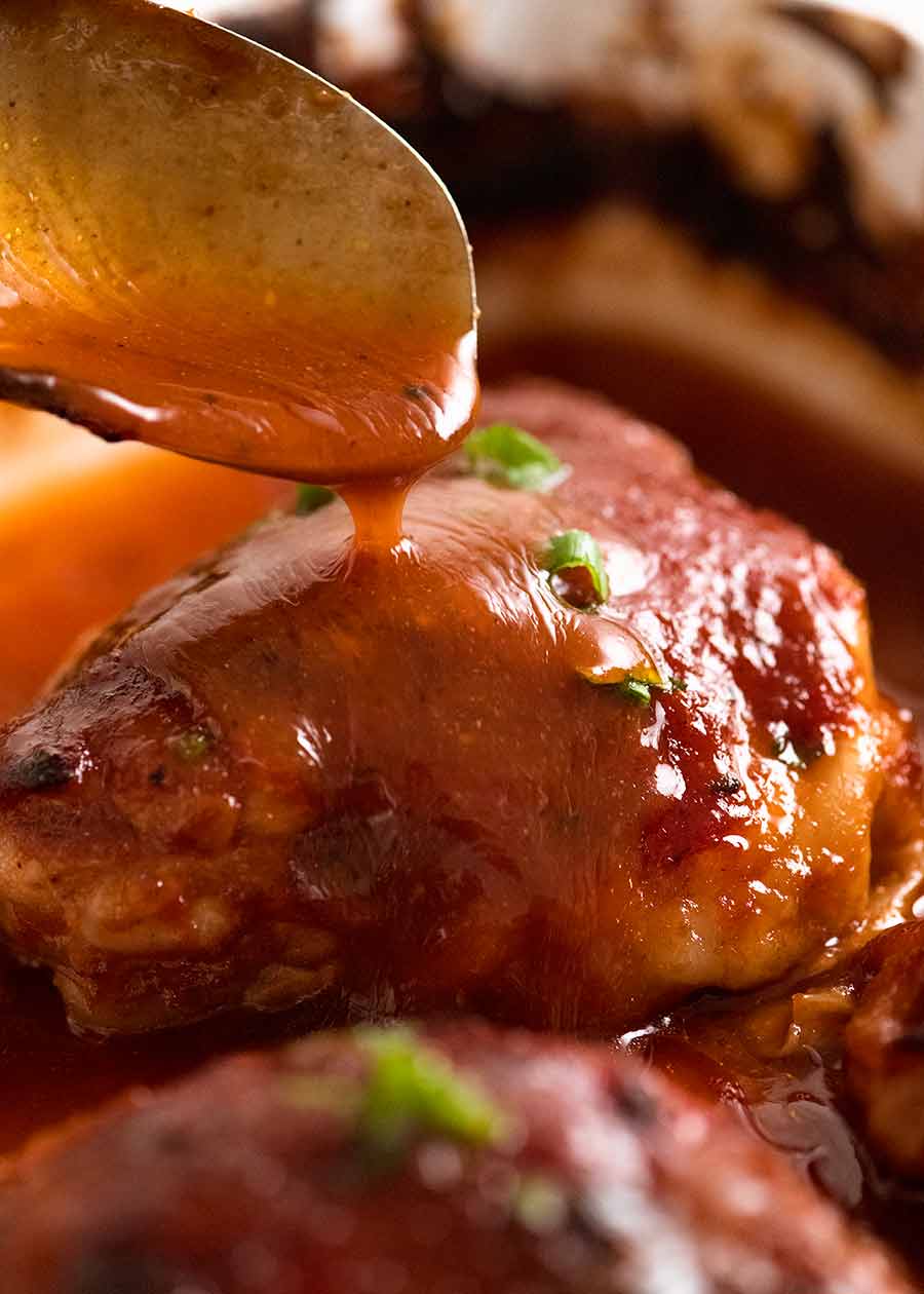 Pour barbecue sauce over Oven Baked BBQ Chicken
