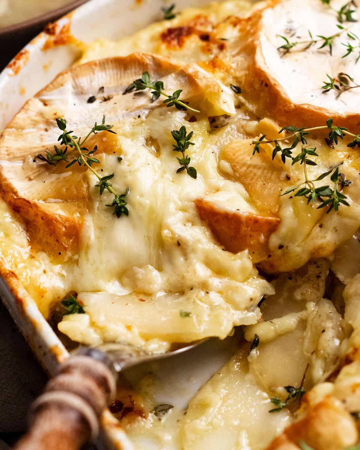 Scooping Brie Dauphinoise Potatoes