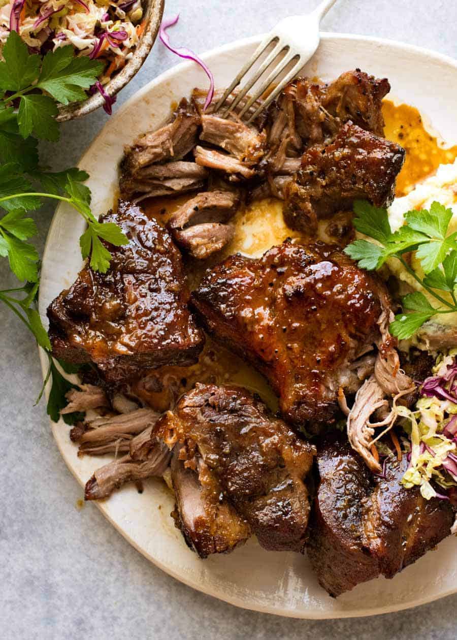 Overhead photo of Brown Sugar Garlic Butter Roast Pork on a plate with a side of cabbage salad