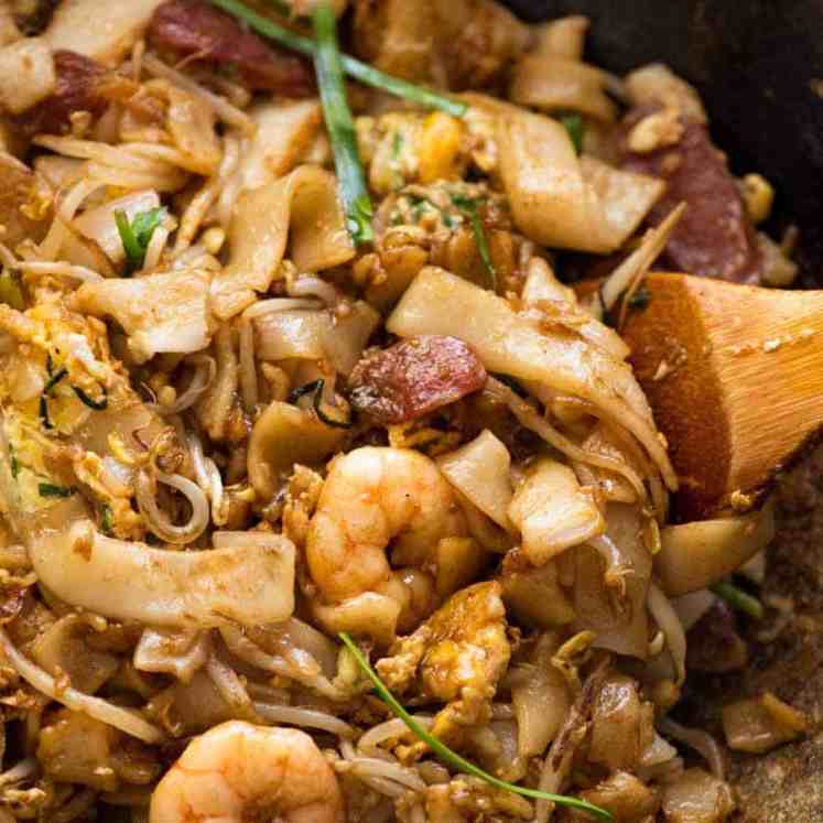 Char Kway Teow in a wok, fresh off the stove