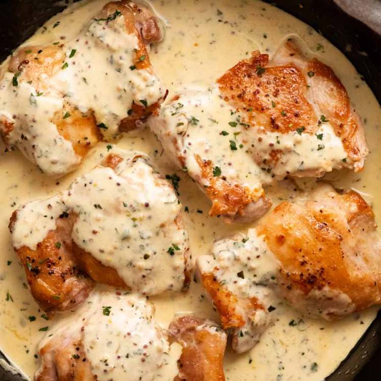 Freshly made Chicken with Creamy Mustard Sauce in a skillet ready to be served