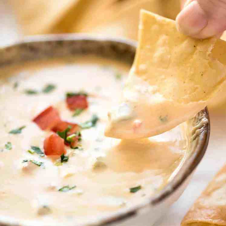 Code cracked: Queso Dip made with real cheese that's ultra silky even when it cools. recipetineats.com