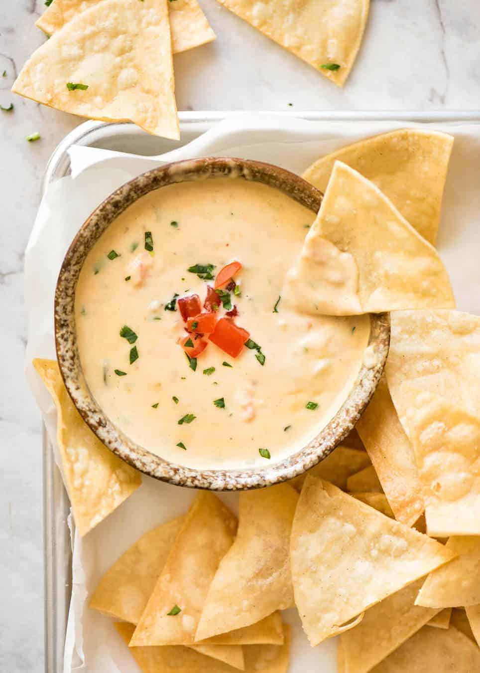 Code cracked: Queso Dip made with real cheese that's ultra silky even when it cools. www.recipetineats.com