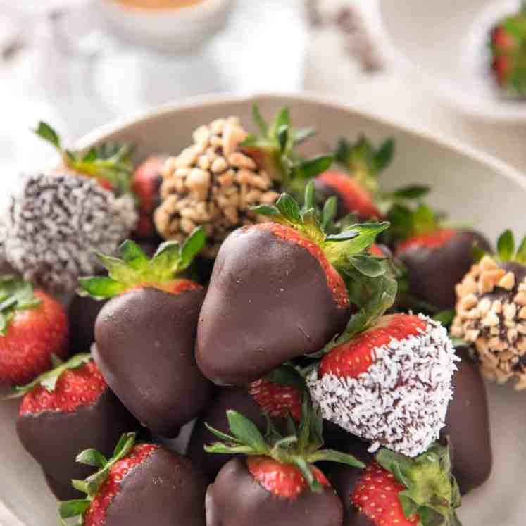 Chocolate Covered Strawberries - 1 cup of chocolate chips, 2 tsp oil (for shine + stop chocolate from cracking) and strawberries is all you need! Fast, fabulous and just 47 calories per piece. recipetineats.com