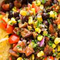 I call this a PIG OUT Salsa. Sensible people would call it an Chorizo, Black Bean and Corn Salsa. :) recipetineats.com