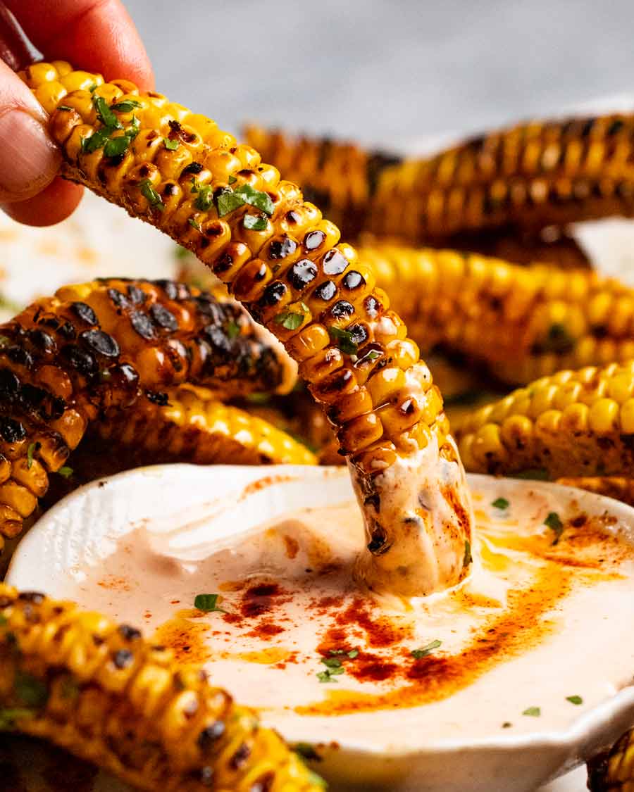 Dipping Corn ribs in sauce