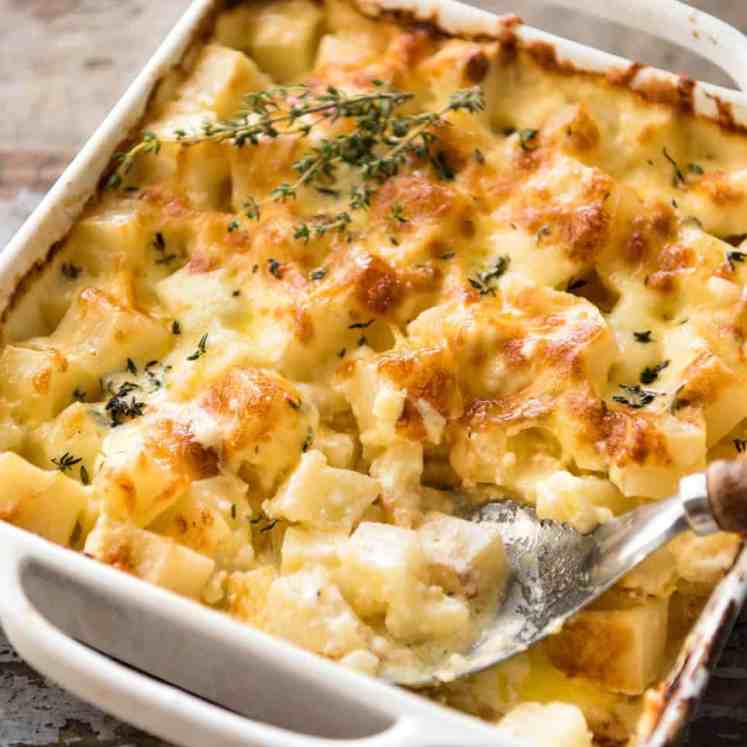 A faster, cheesier, creamier alternative to Scalloped Potatoes / Potato Gratin, this Easy Creamy Cheesy Potato Bake is made with cubed potatoes cooked in a cream and cheese sauce. www.recipetineats.com