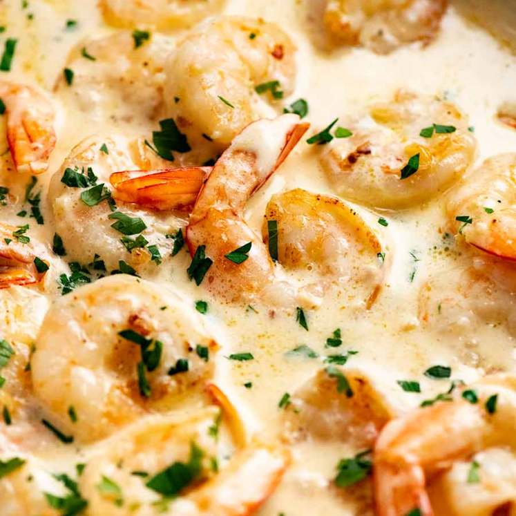 Close up of Creamy Garlic Prawns (Shrimp) in a skillet, ready to be served