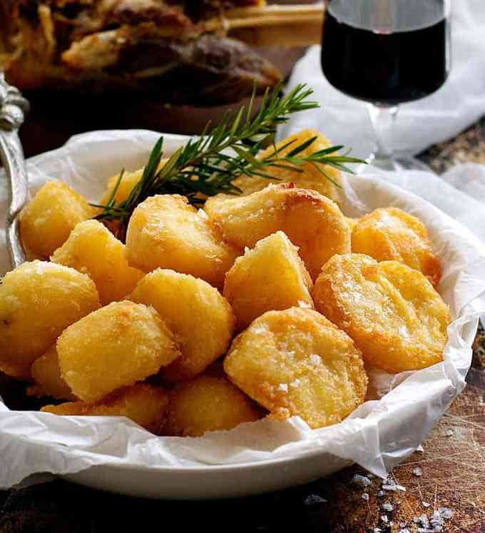 Truly Crunchy Roast Potatoes - par boil, rough up the surface, dust with semolina then bake in a very hot oven in preheated oil. Based on a Nigella recipe.