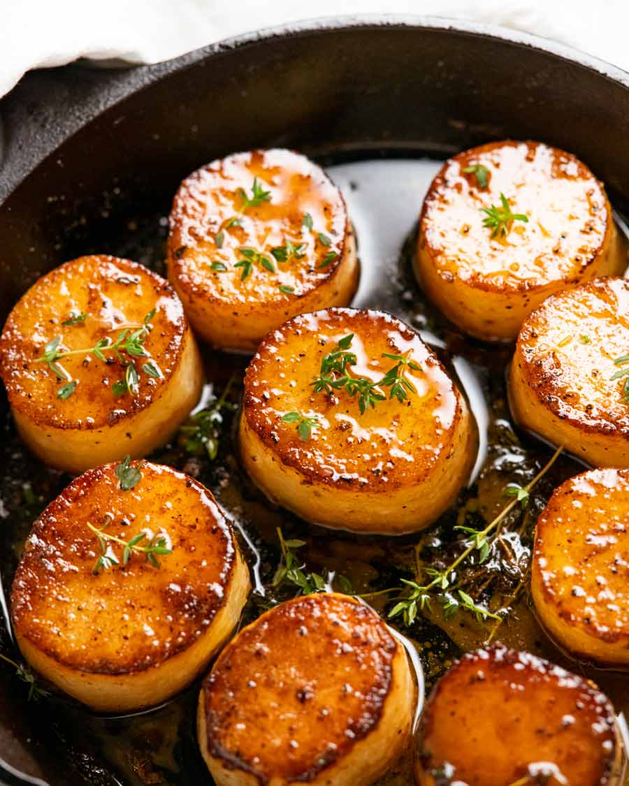 Fondant potatoes in a skillet