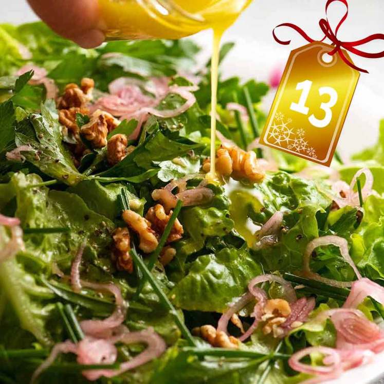 Drizzling lemon dressing over French Bistro Salad