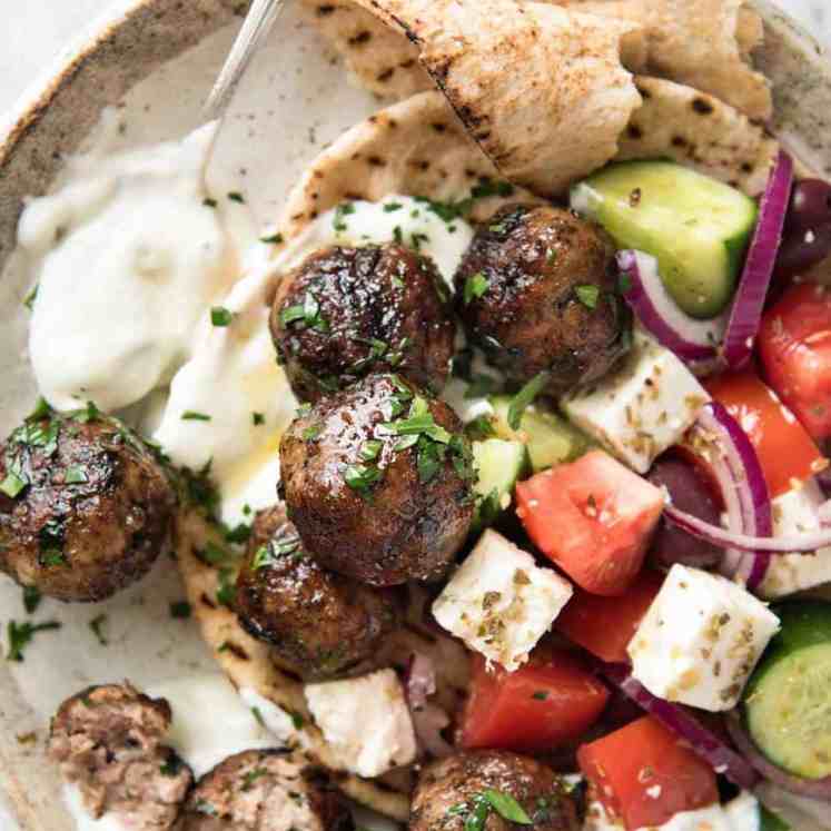 Soft, juicy, beautifully flavoured GREEK MEATBALLS! Serve as an appetiser with tzatziki, main with Greek Salad or make wraps! recipetineats.com