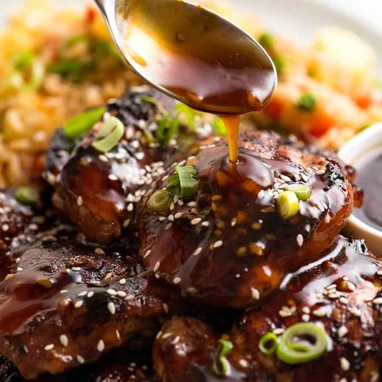 Pour honey soy sauce over chicken