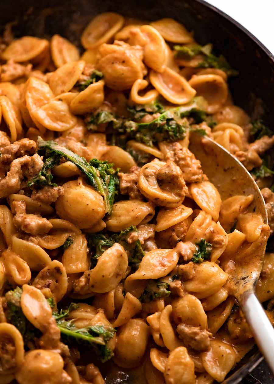 Close up of Orecchiette Sausage Pasta in Creamy Tomato Sauce in skillet, ready to be served