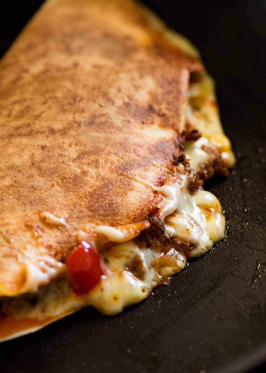 Close up of Quesadilla being cooked in a black skillet