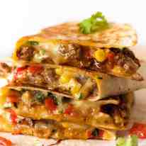 Stack of freshly cooked Quesadillas, crispy on the outside and molten cheesy goodness on the inside.