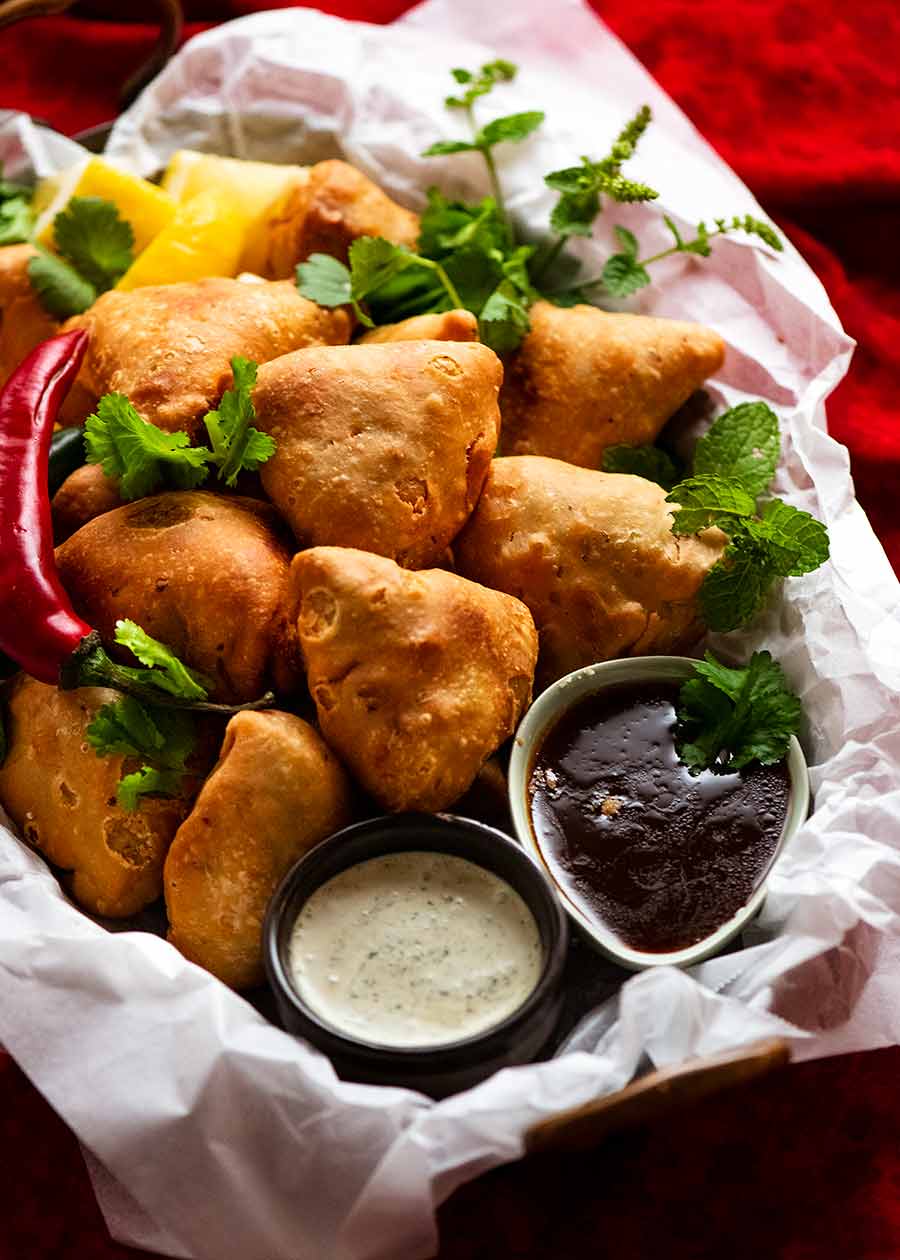 Pile of Samosas on a plate, ready to be eaten