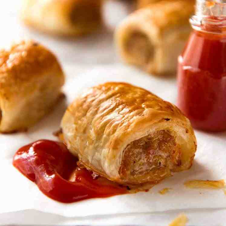 Close up of Sausage Roll with tomato sauce